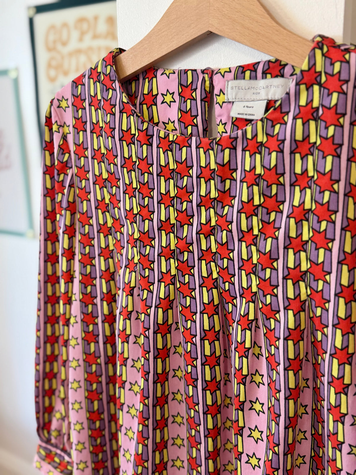 6, Stella McCartney, Pink, Yellow/red/purple pleated stripes & star long-sleeve dress